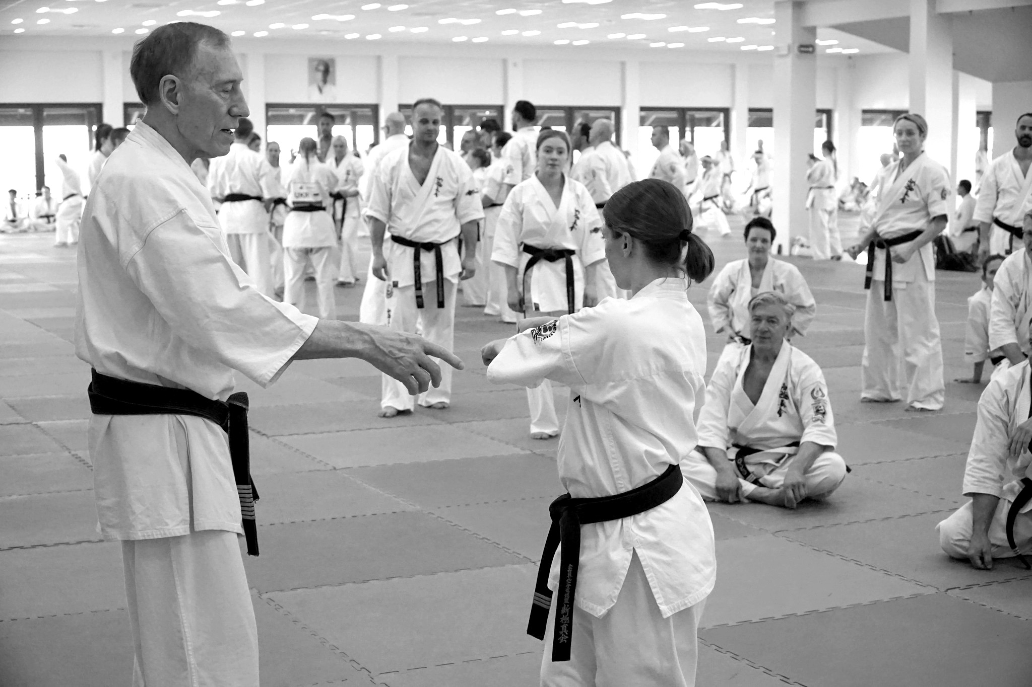 A Kyokushin instructor teaching students in the dojo