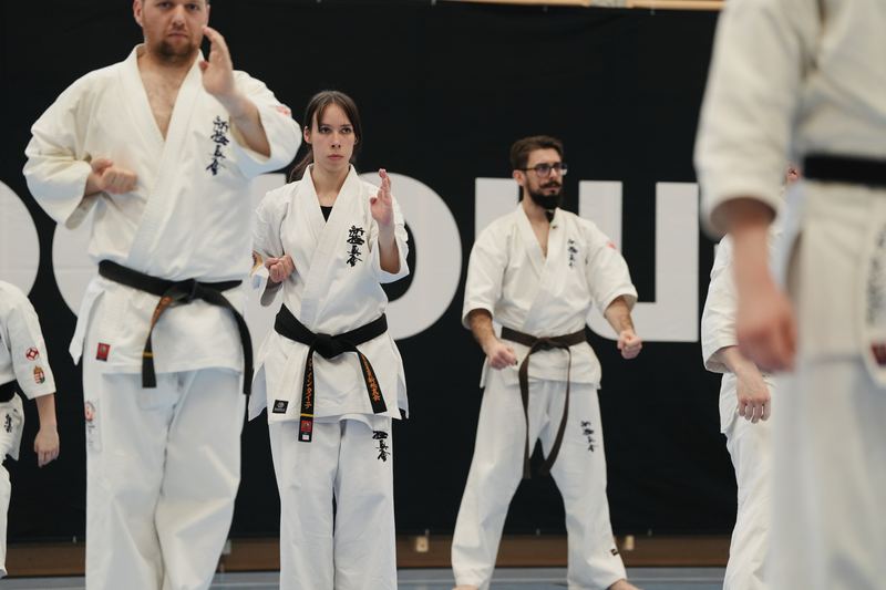 Participants practising in front of the dojoHUB banner